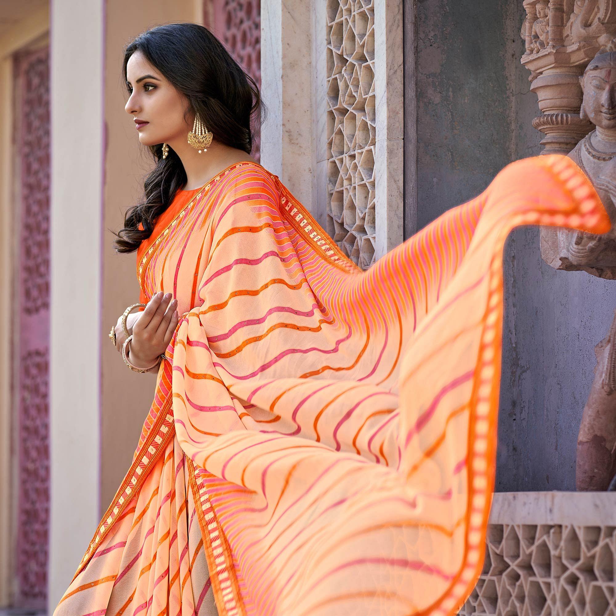 Orange Printed With Embellished Georgette Saree - Peachmode