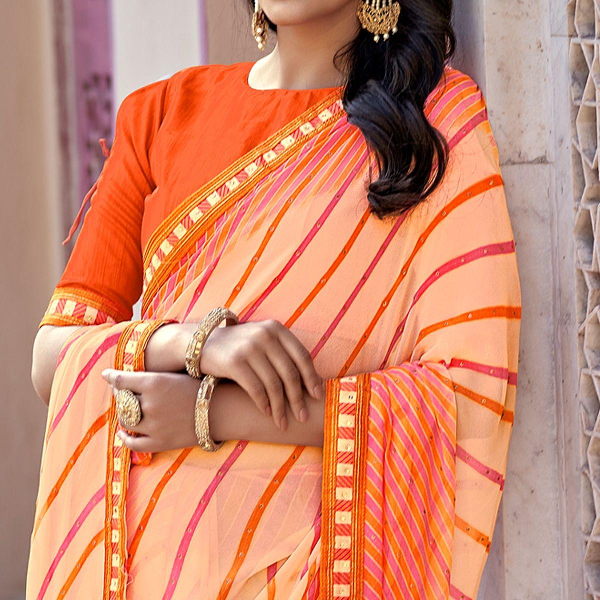Orange Printed With Embellished Georgette Saree - Peachmode