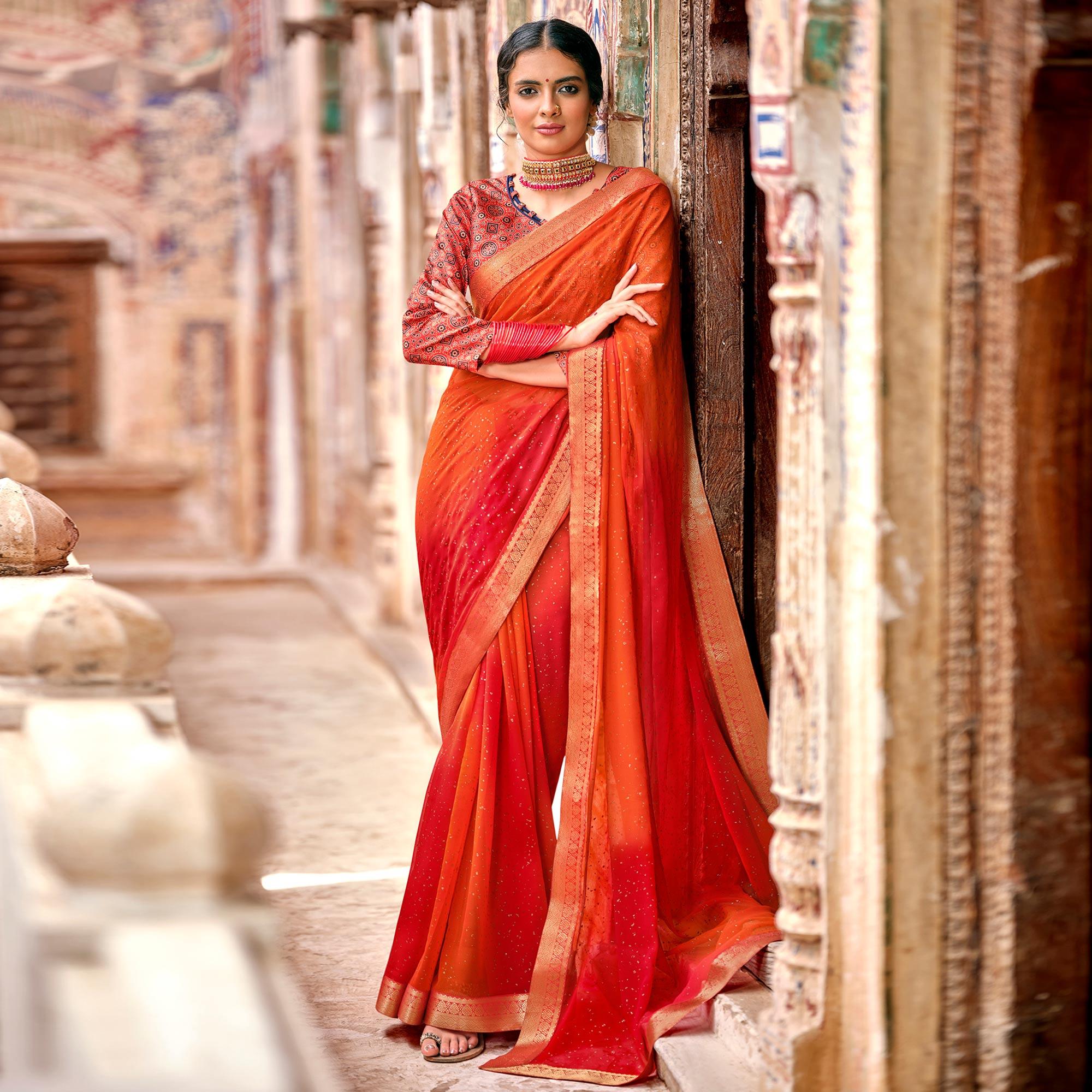 Orange-Red Partywear Printed Georgette Saree With Gold Zari - Peachmode