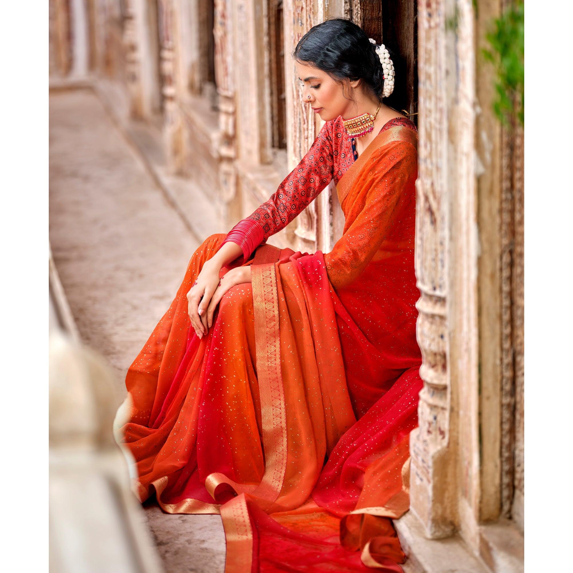 Orange-Red Partywear Printed Georgette Saree With Gold Zari - Peachmode