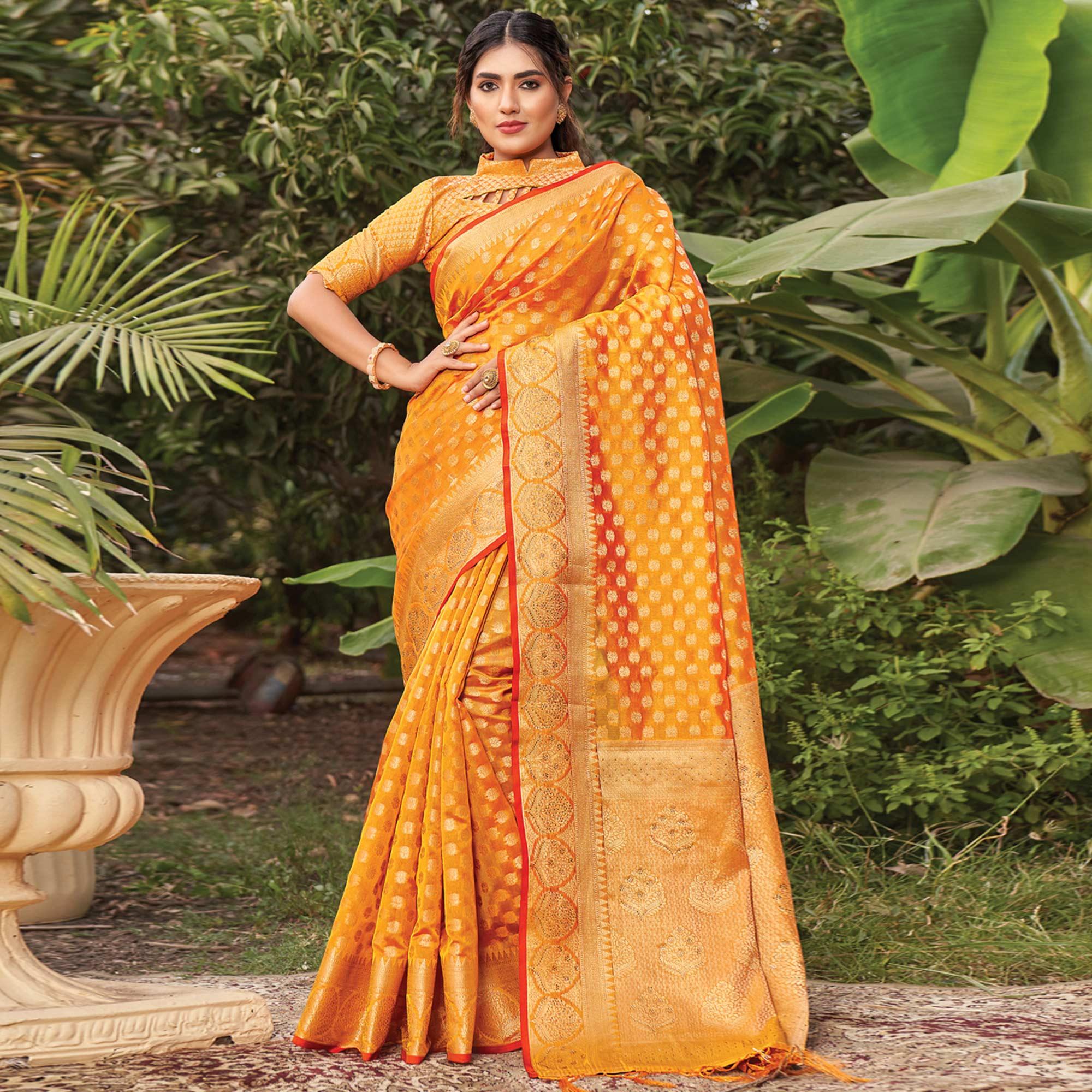 Orange Woven Organza Saree with Tassels - Peachmode