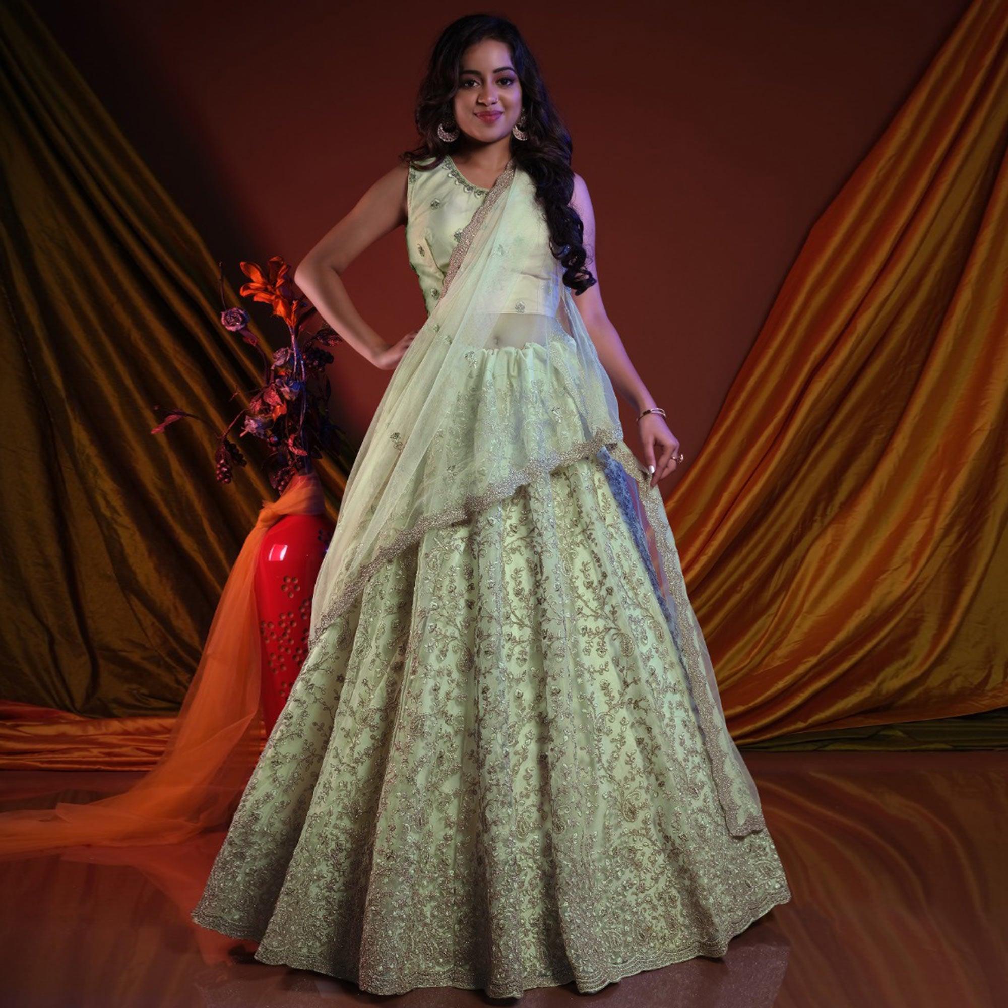 Pista Green Embroidered Netted Lehenga Choli - Peachmode