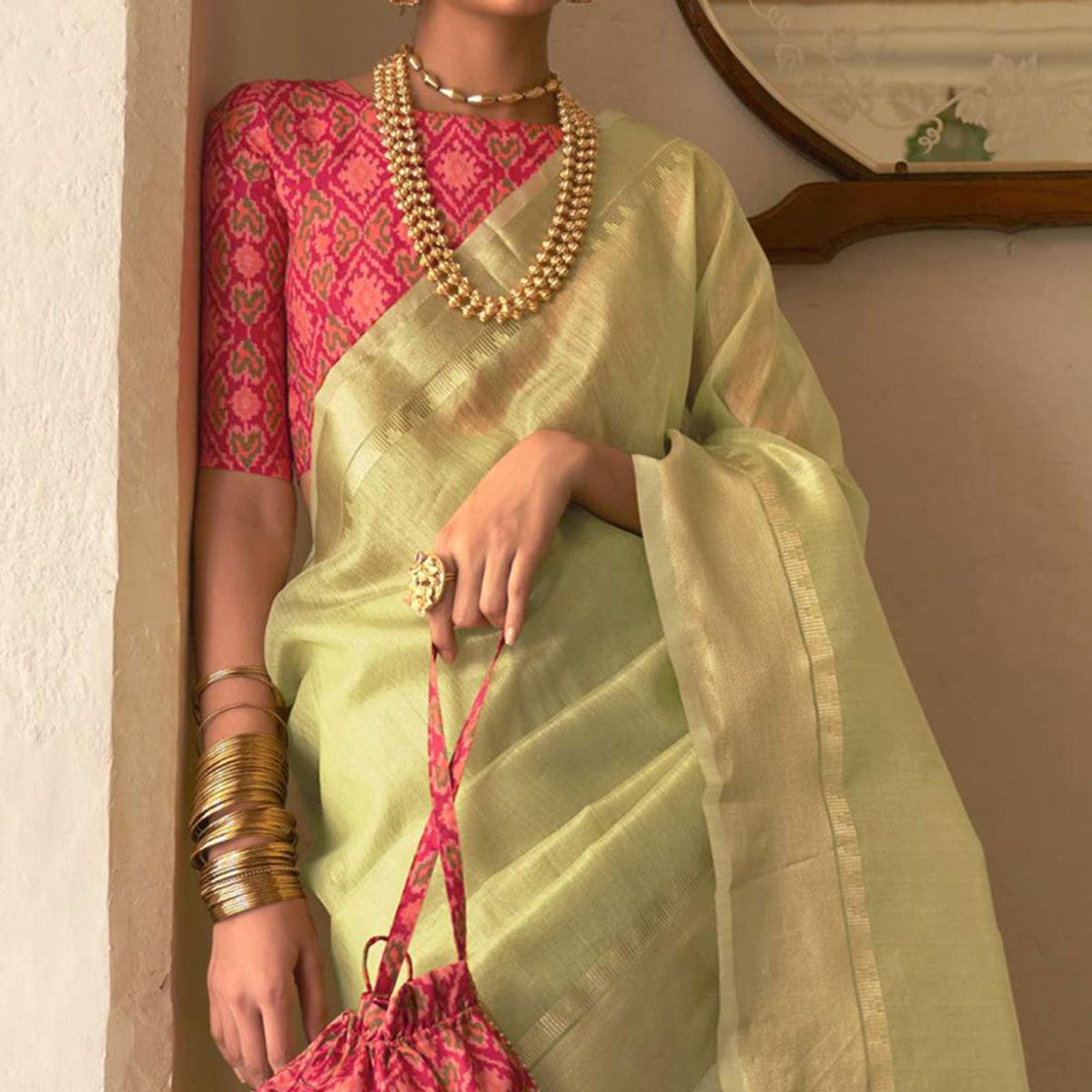 Pista Green Woven Organza Saree With Tassels - Peachmode