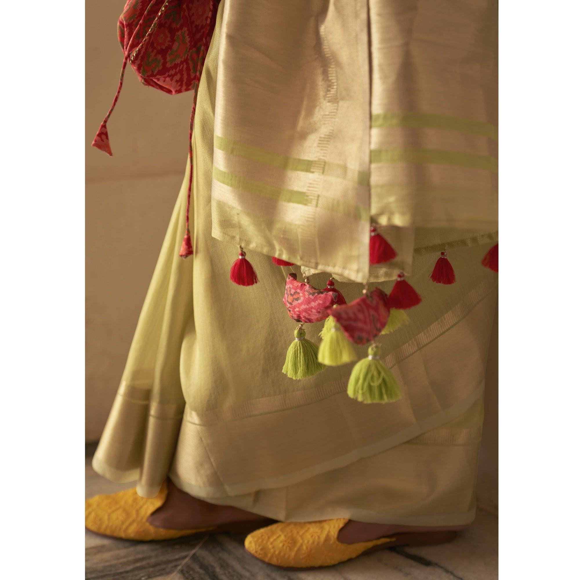 Pista Green Woven Organza Saree With Tassels - Peachmode