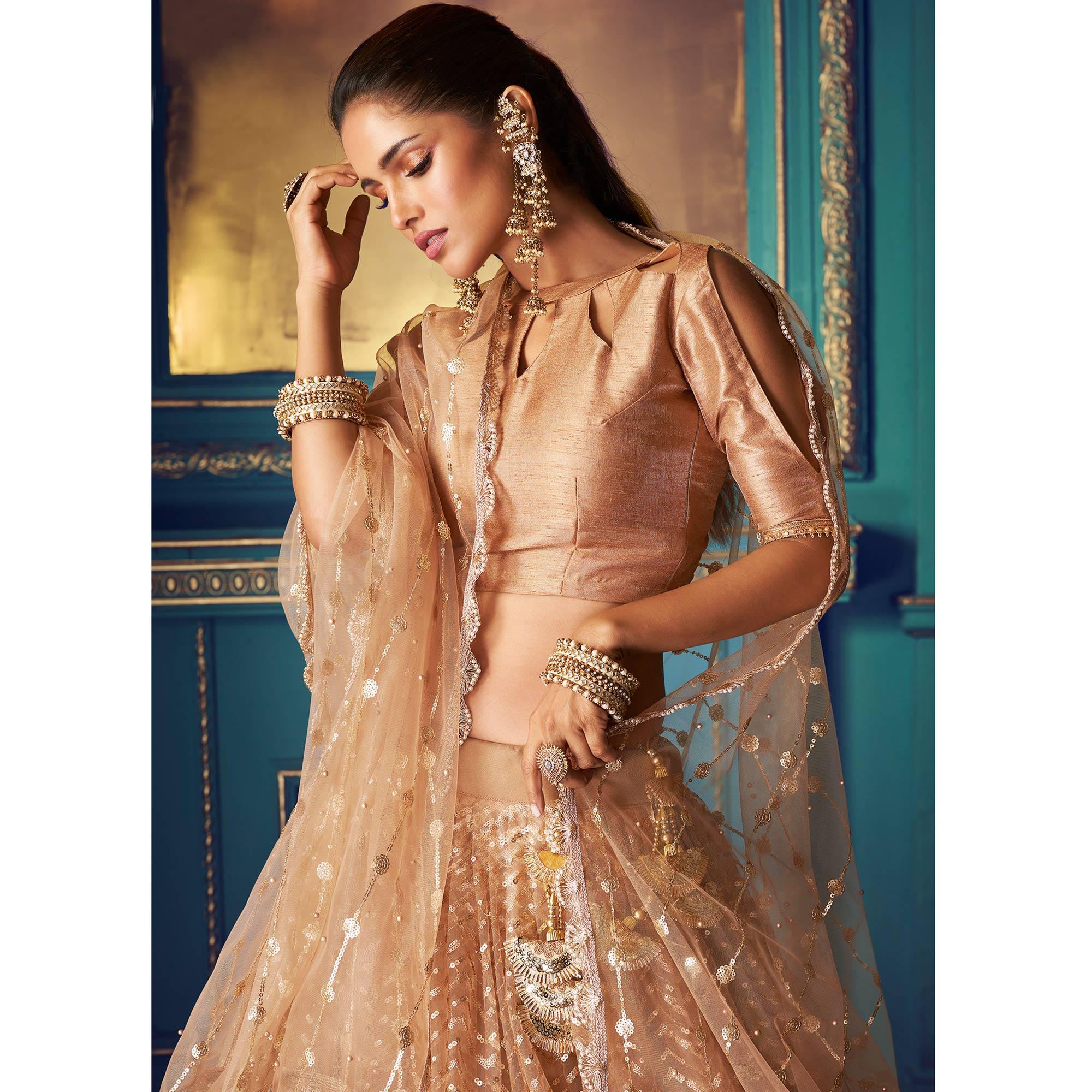 Pleasance Beige Colored Partywear Embroidered Soft Net Lehenga Choli - Peachmode