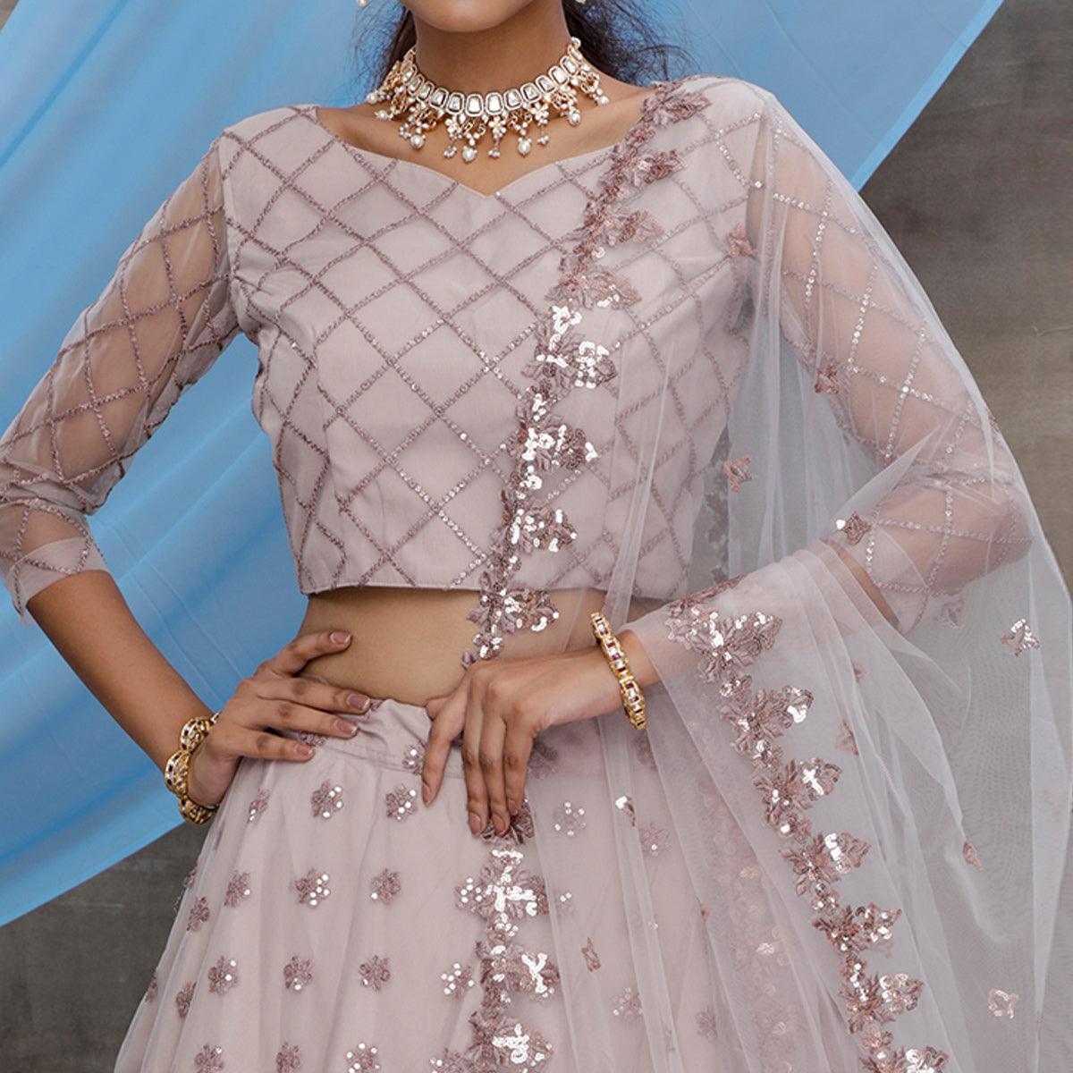 Preferable Dusty Purple Colored Designer Partywear Embroidered Net Lehenga Choli - Peachmode
