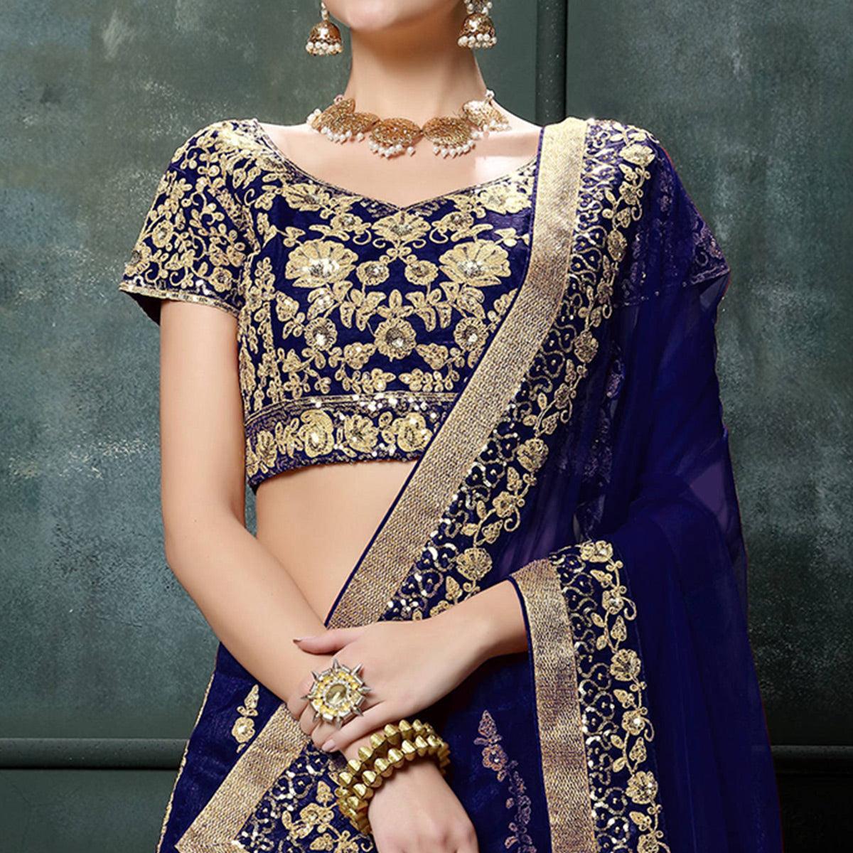Prominent Blue Colored Wedding Wear Embroidered Raw Silk Lehenga - Peachmode