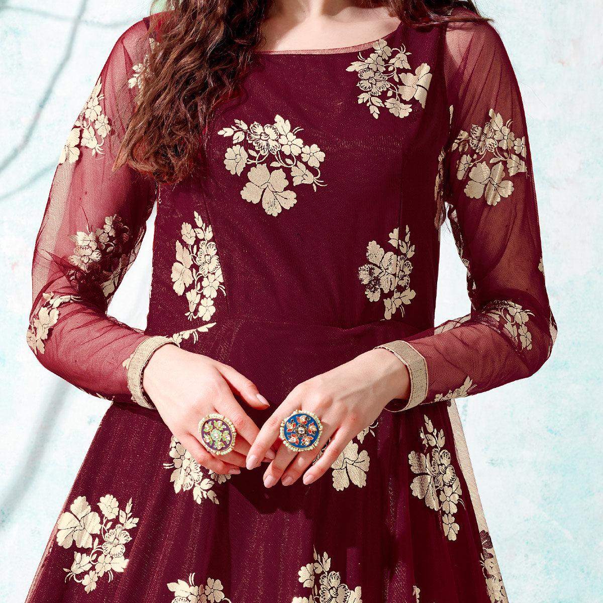 Ravishing Maroon Coloured Partywear Metallic Foil Work Net Gown - Peachmode