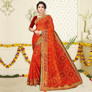 Ravishing Orange Colored Festive Wear Bandhani Print With Zari Border Work And Latkan Heavy Georgette Saree - Peachmode