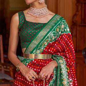 Red Patola Printed Art Silk Saree With Tassels - Peachmode