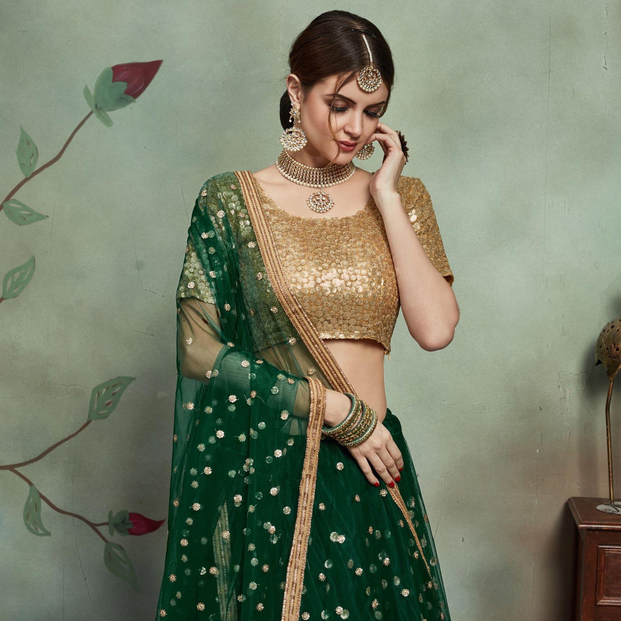 Refreshing Dark Green Colored Partywear Sequins Work Netted Lehenga - Peachmode