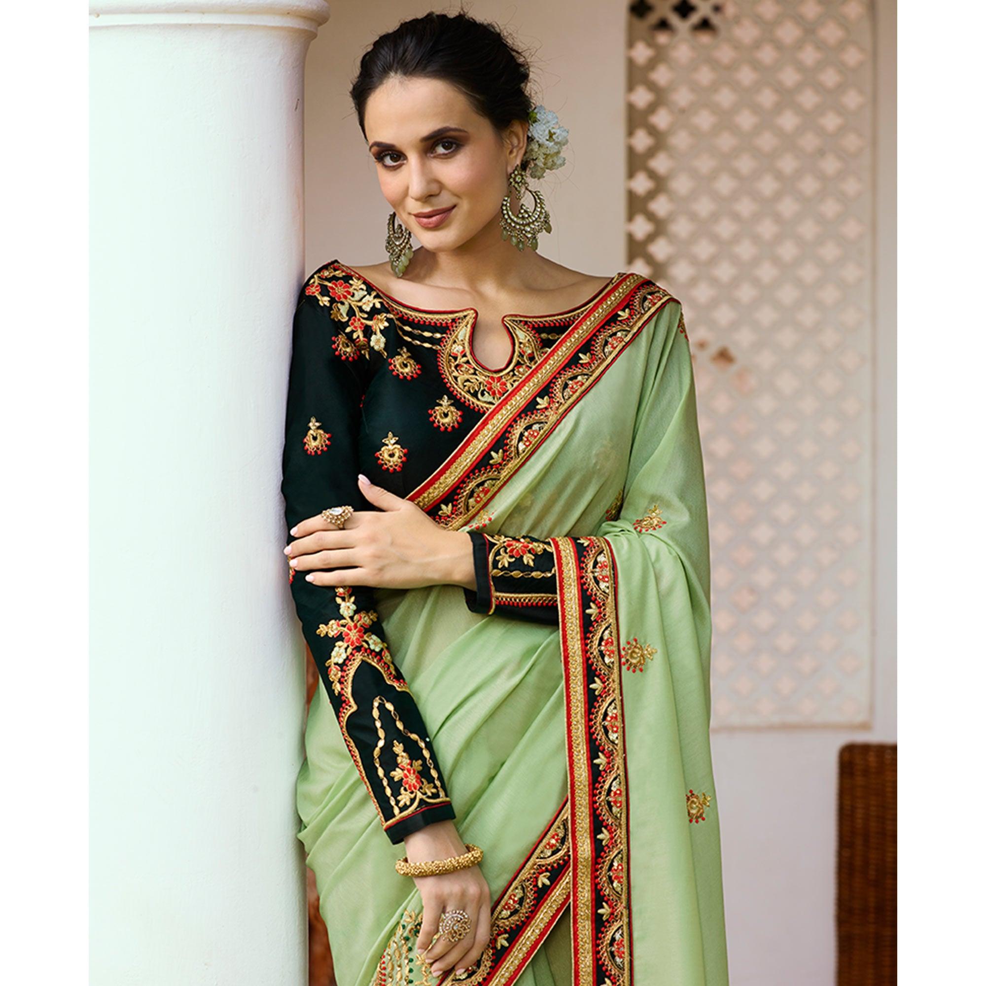 Refreshing Pale Green Colored Partywear Embroidered Silk Saree - Peachmode