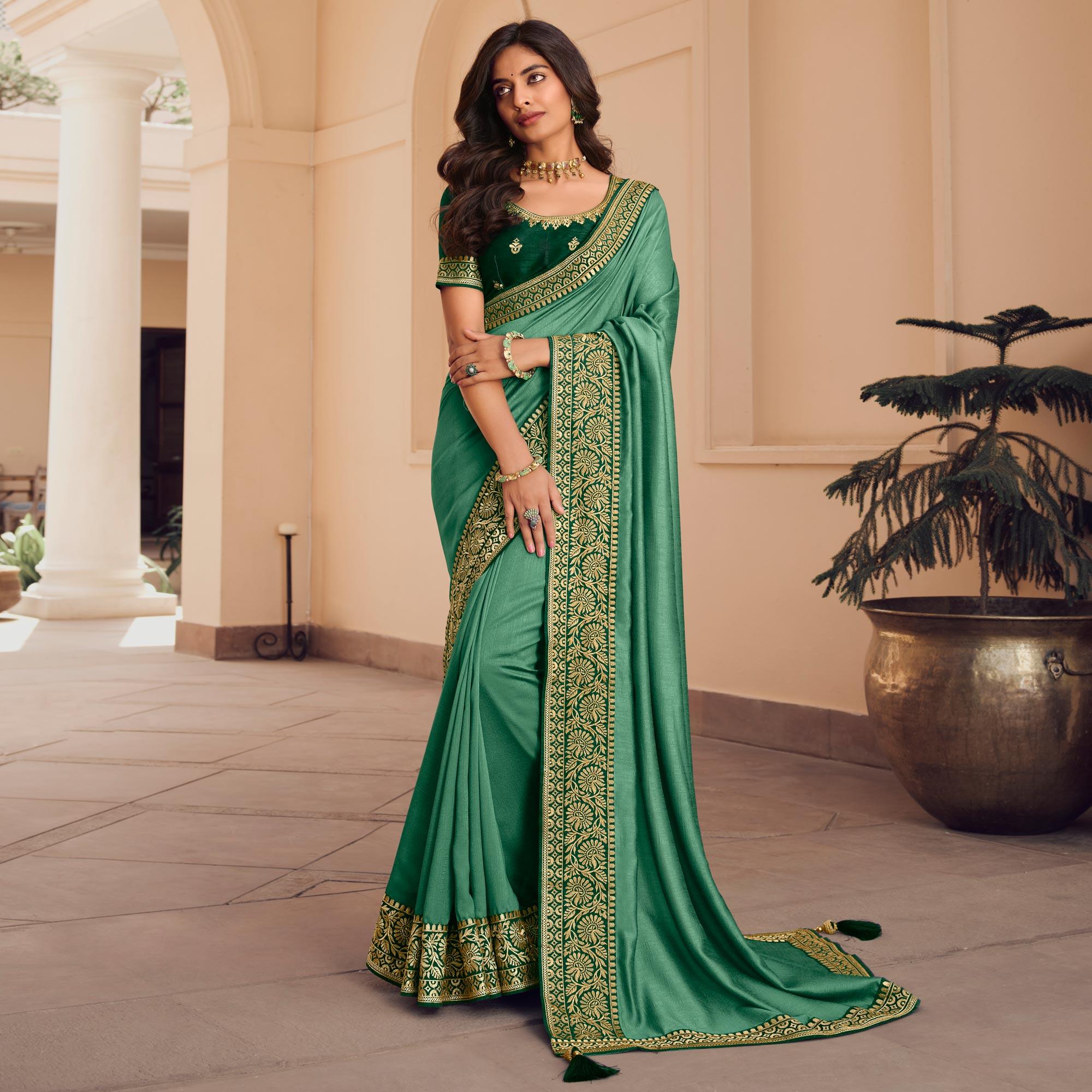 Sea Green Solid Vichitra Silk Saree With Tassels - Peachmode
