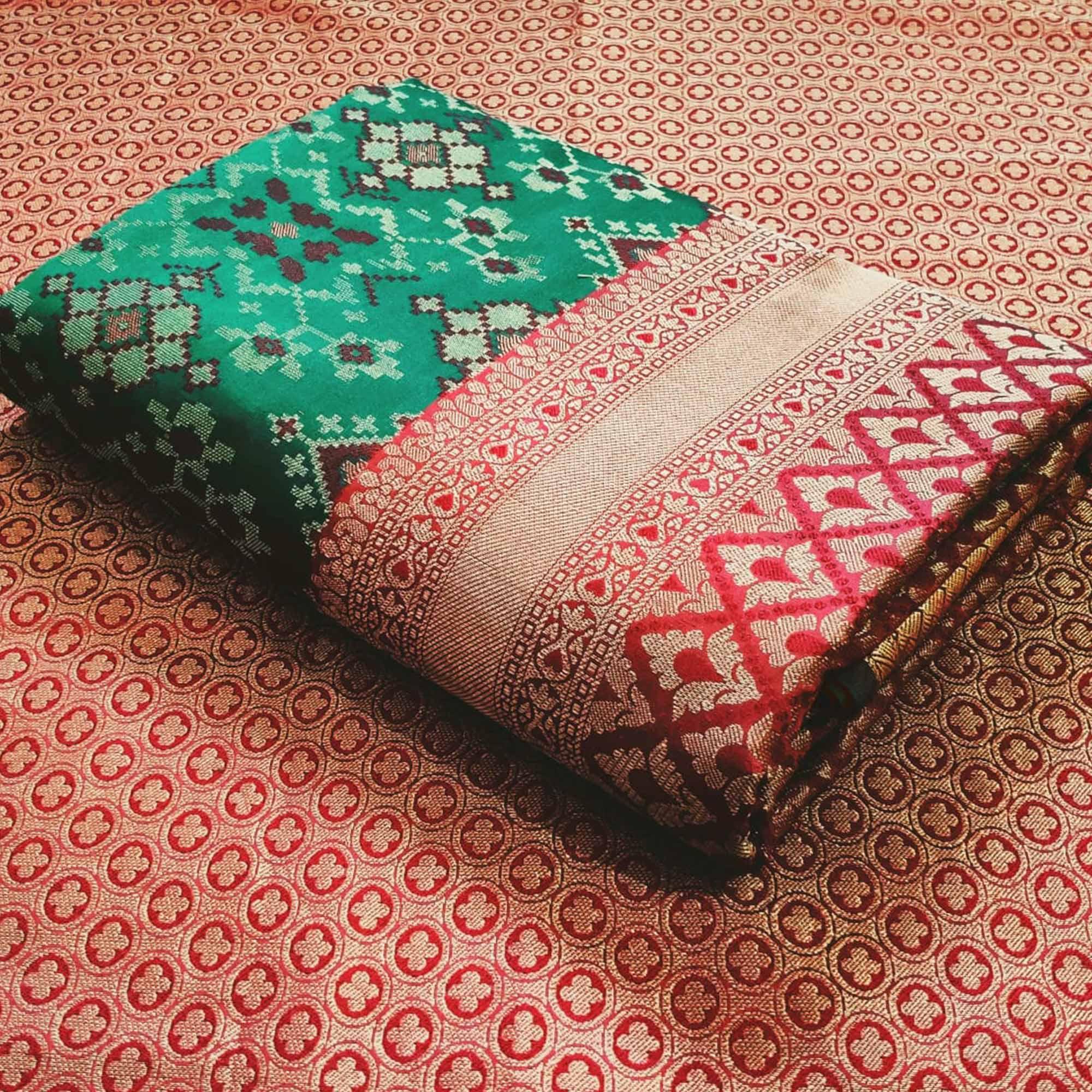 Stunning Rama Green Colored Festive Wear Woven Patola Silk Saree - Peachmode