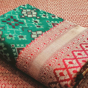 Stunning Rama Green Colored Festive Wear Woven Patola Silk Saree - Peachmode