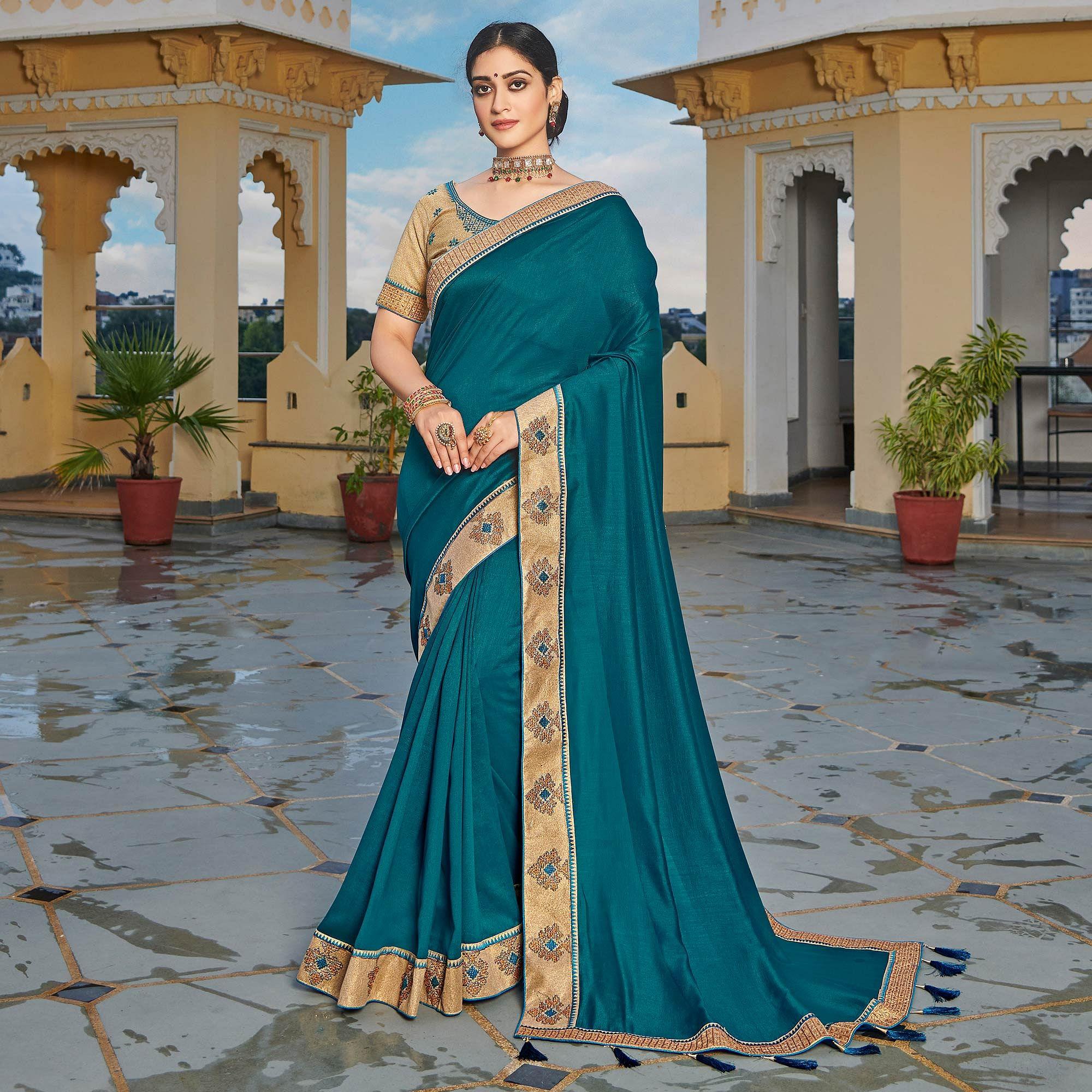 Teal Blue Solid-Embroidered Border Vichitra Silk Saree With Tassels - Peachmode