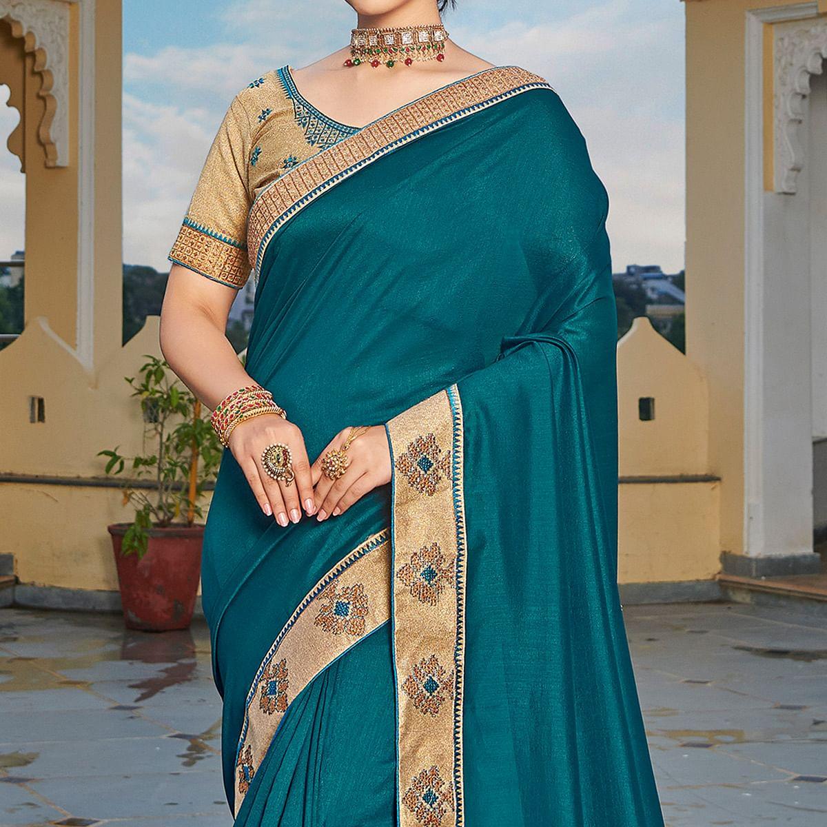 Teal Blue Solid-Embroidered Border Vichitra Silk Saree With Tassels - Peachmode