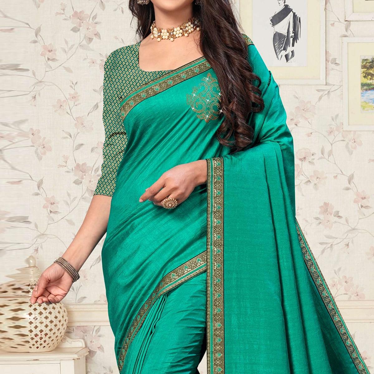 Turquoise Festive Wear Embellished Vichitra Silk Saree - Peachmode