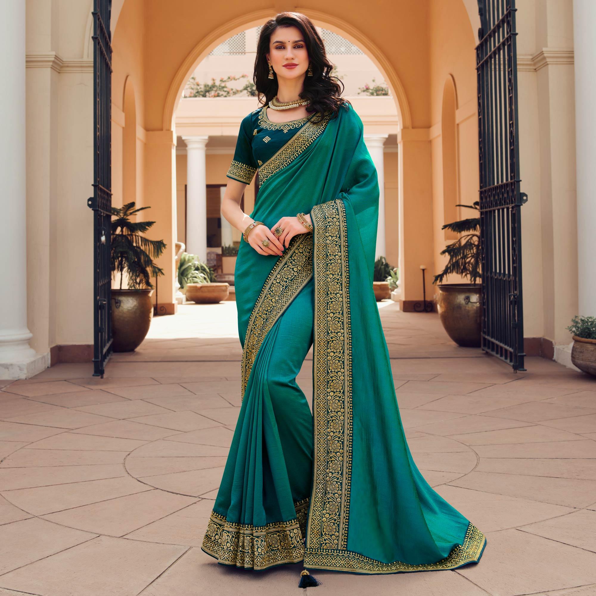Turquoise Solid Vichitra Silk Saree With Tassels - Peachmode