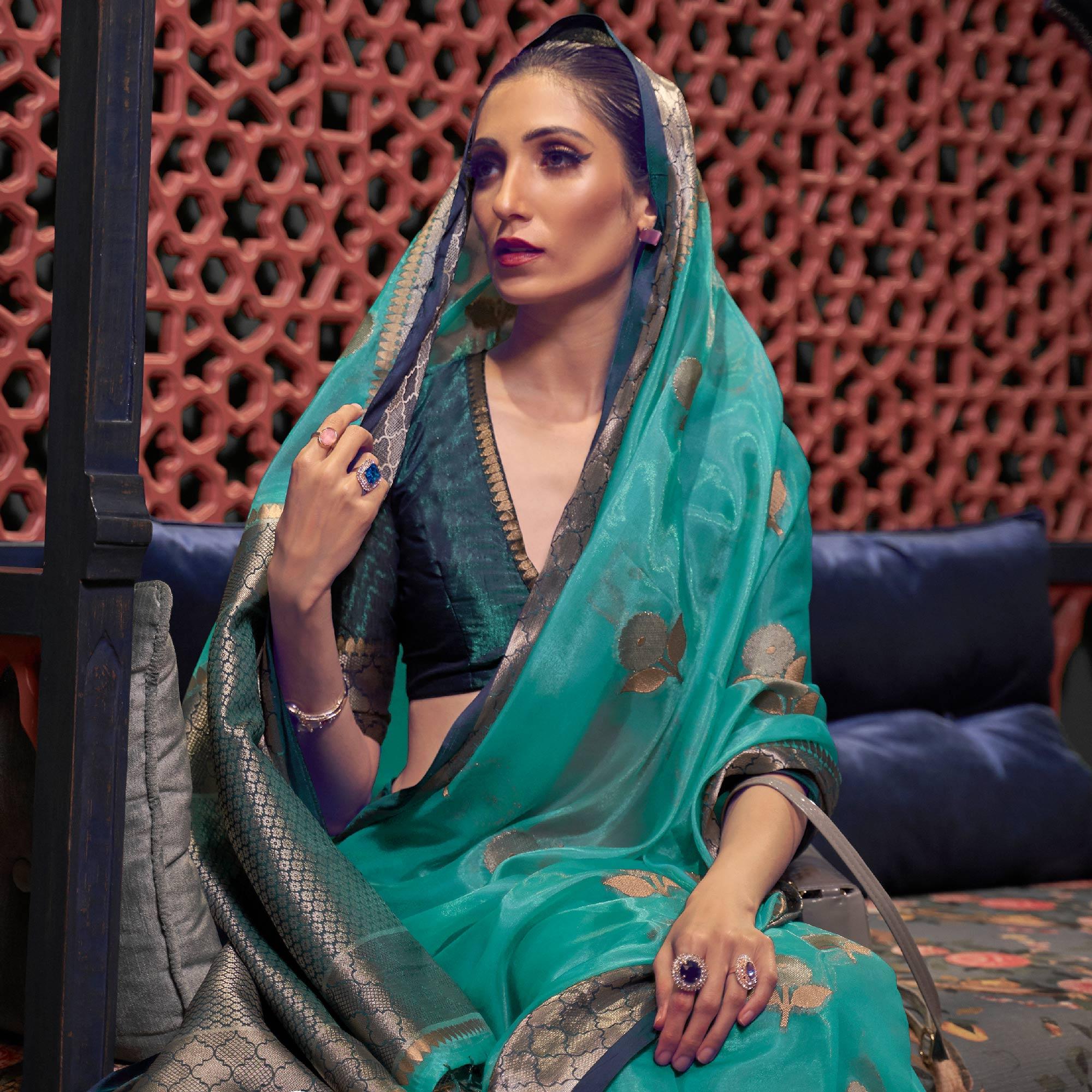 Turquoise Woven Organza Saree With Tassels - Peachmode