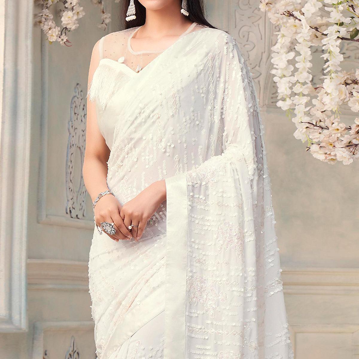 White Sequence Embroidered Georgette Saree With Tassels - Peachmode