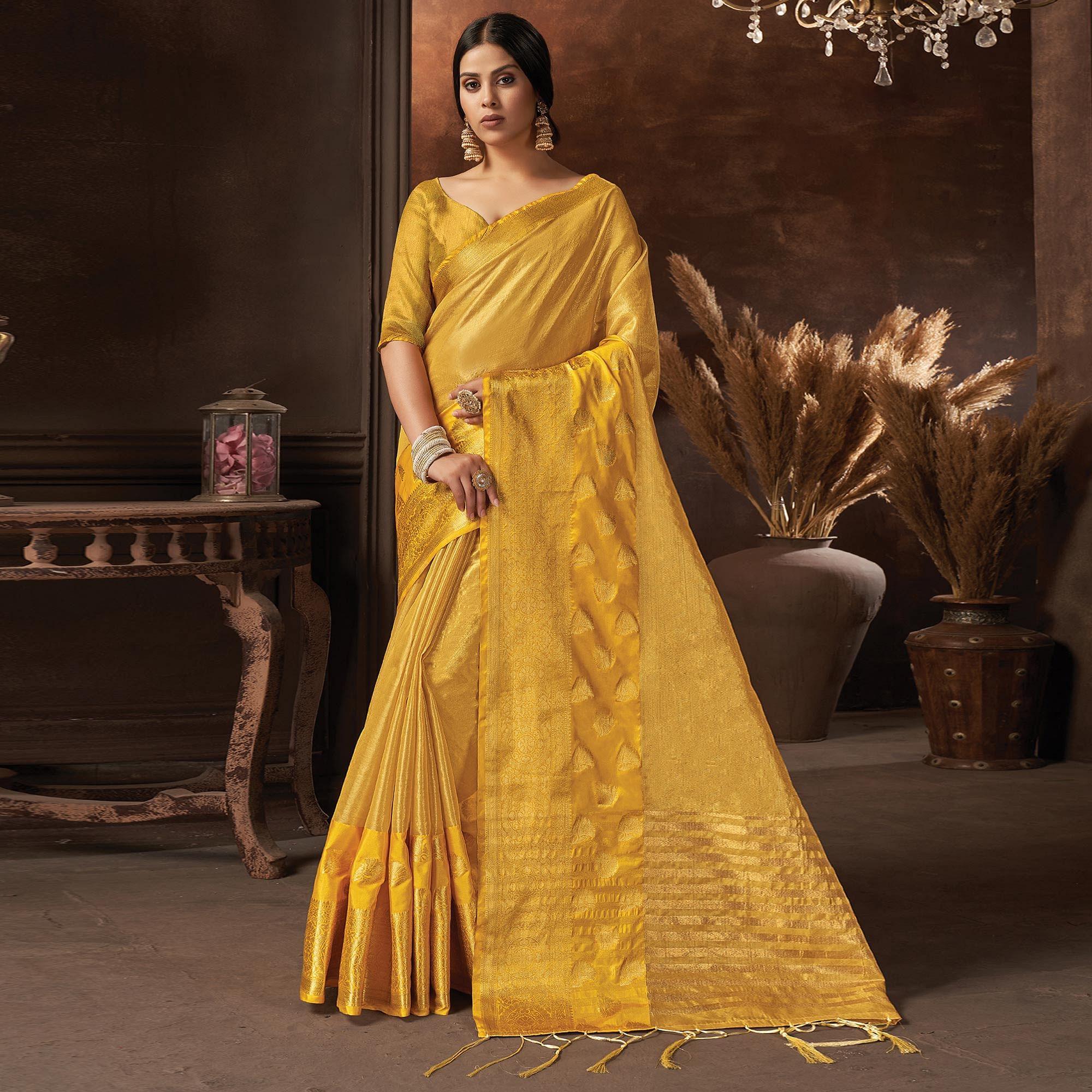Yellow Festive Wear Solid Organza Saree With Tassels - Peachmode