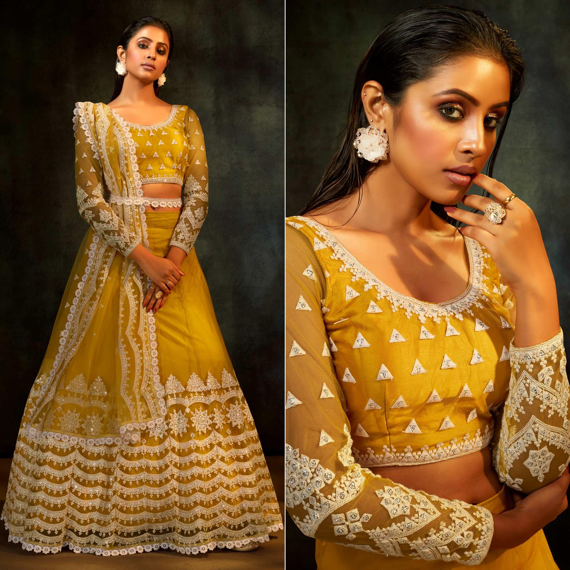 Yellow Partywear Sequence Embroidered Net Lehenga Choli - Peachmode