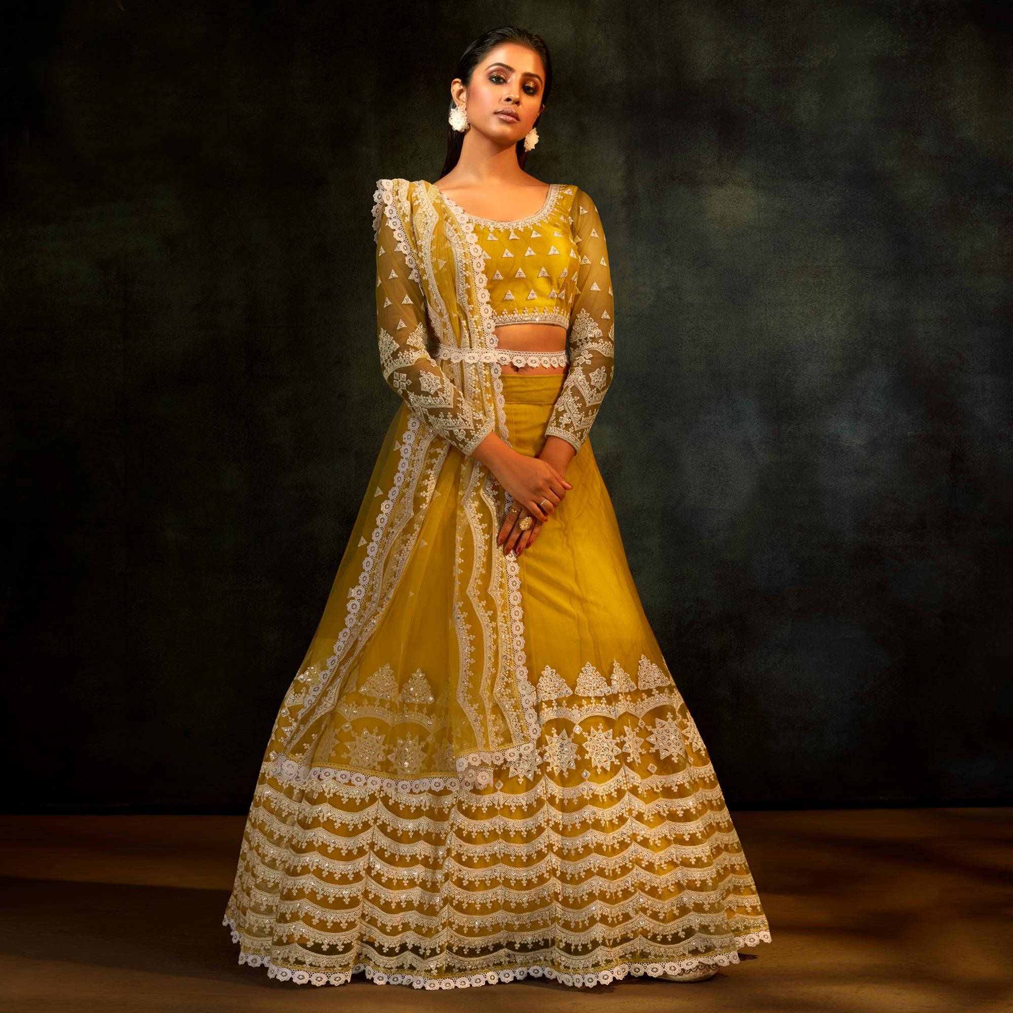 Yellow Partywear Sequence Embroidered Net Lehenga Choli - Peachmode