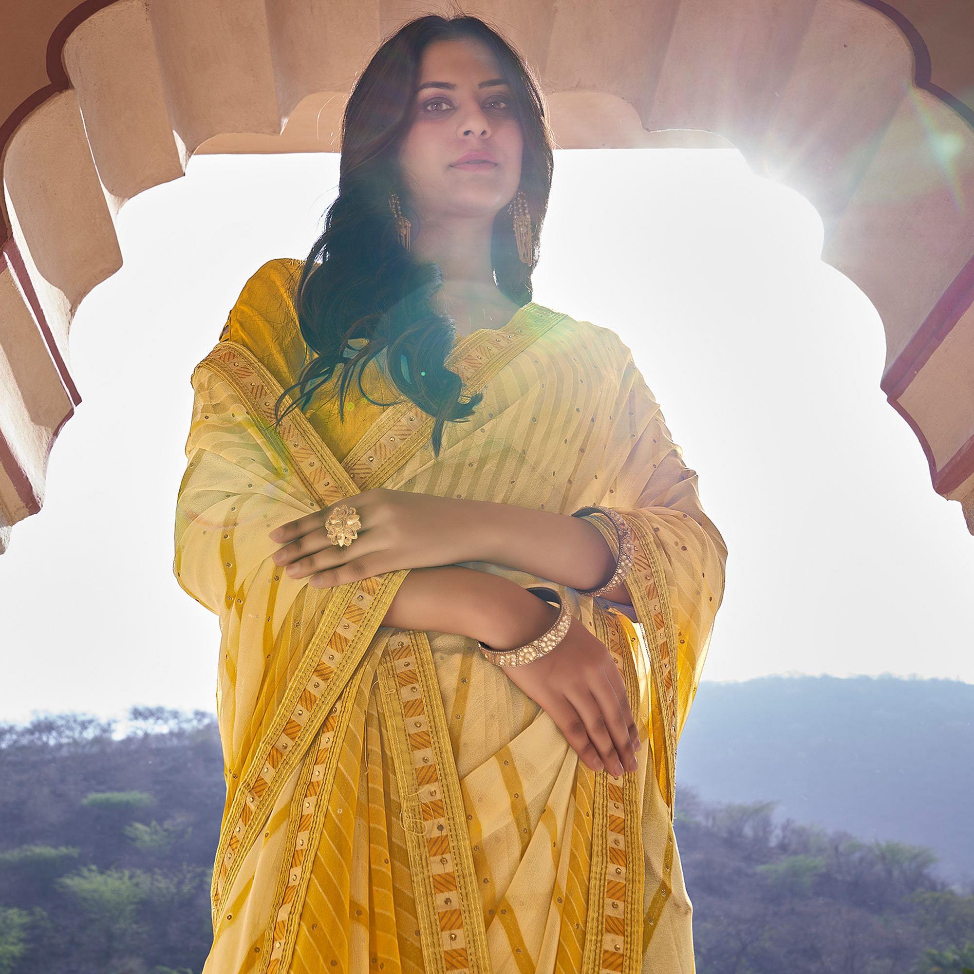 Yellow Printed With Embellished Georgette Saree - Peachmode
