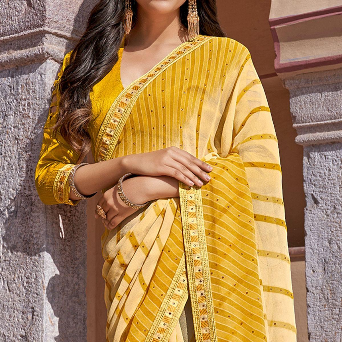 Yellow Printed With Embellished Georgette Saree - Peachmode