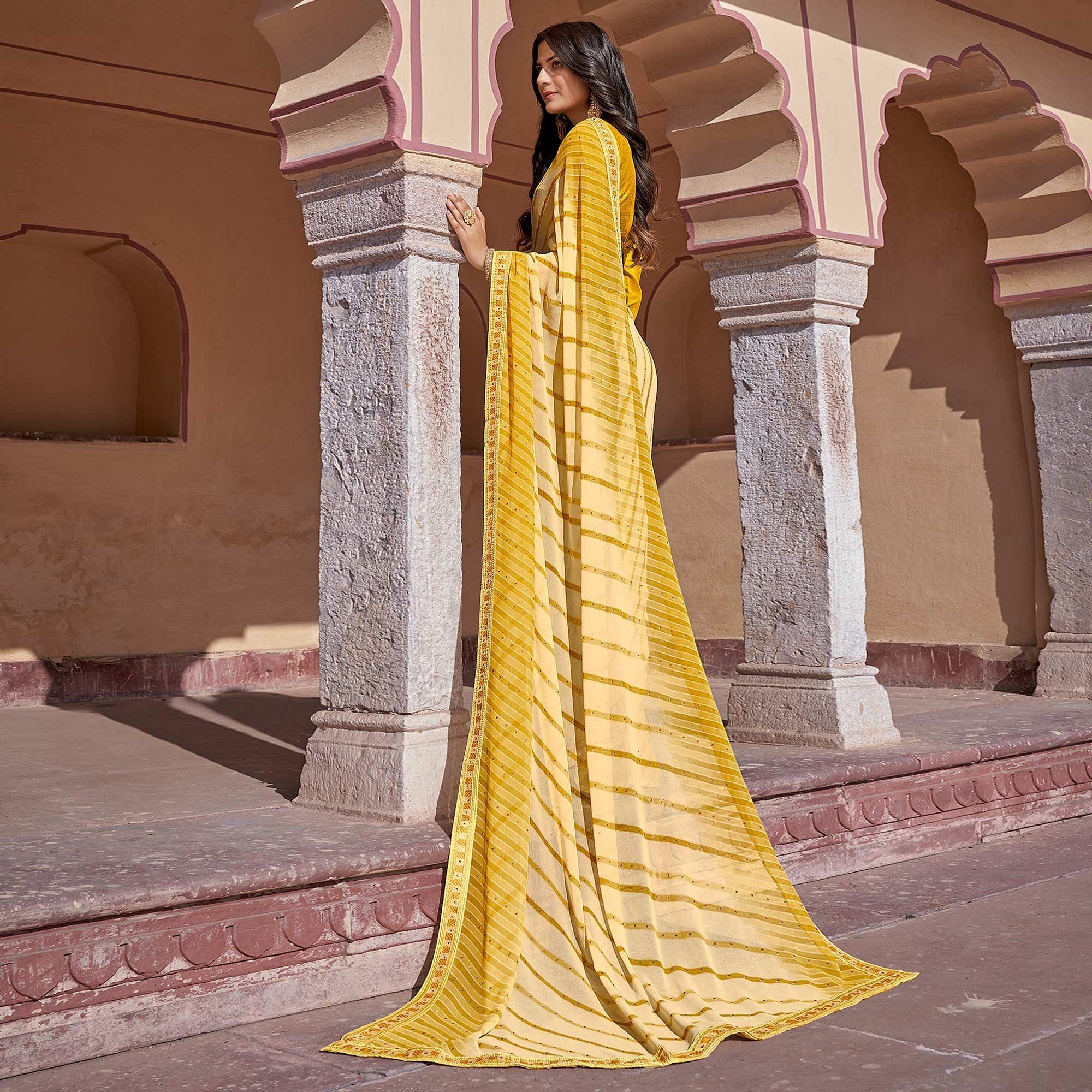 Yellow Printed With Embellished Georgette Saree - Peachmode