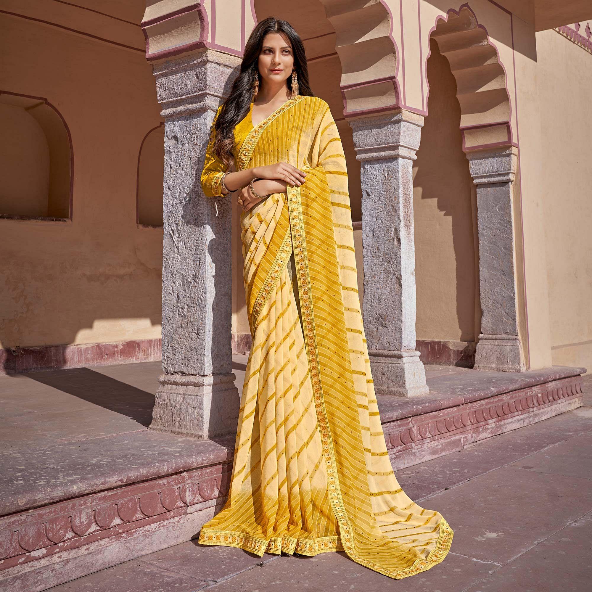 Yellow Printed With Embellished Georgette Saree - Peachmode