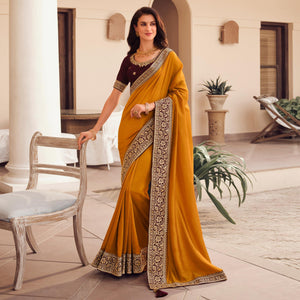 Yellow Solid Vichitra Silk Saree With Tassels - Peachmode