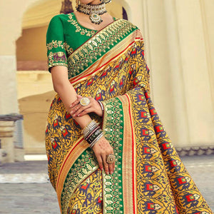 Yellow Wedding Wear Resham With Embellished Silk Patola Saree - Peachmode