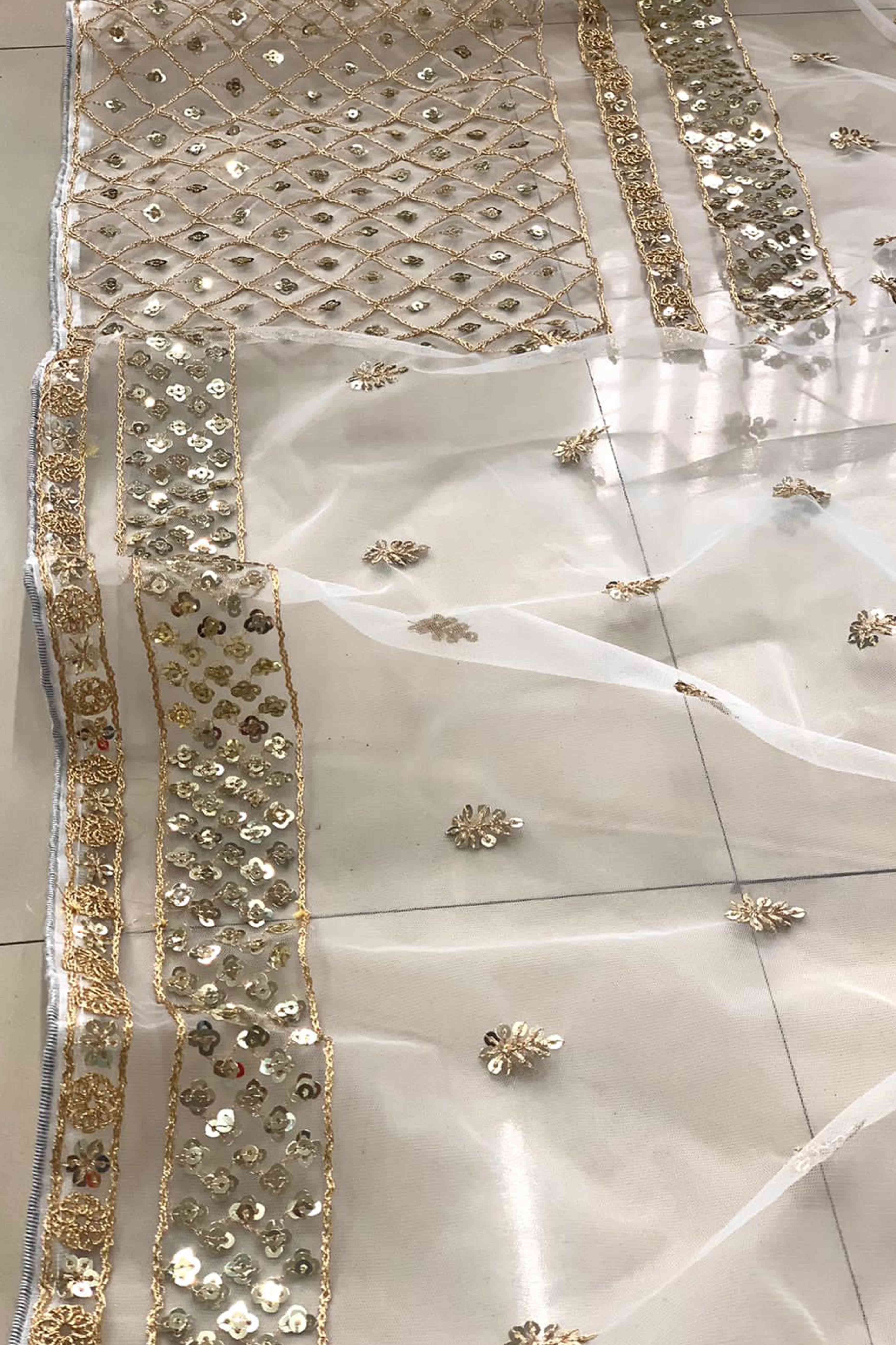 Graceful Off White Sequins Embellished Net Saree for Partywear