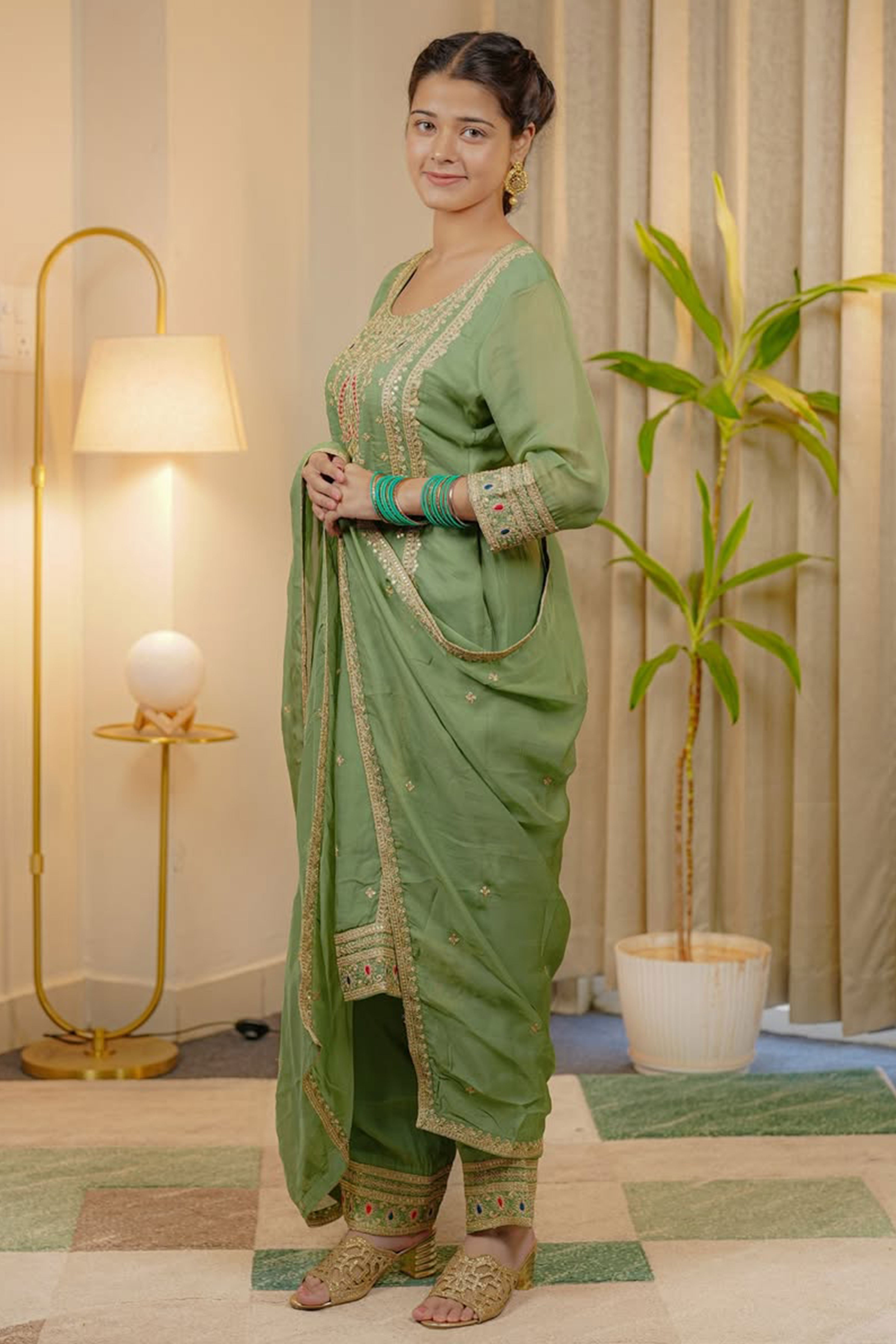 Green Organza Suit Accented with Thread & Sequins Work