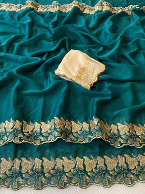 Elegant Teal Solid Georgette Saree Highlighted With A Delicate Floral Embroidered Border - Image 2