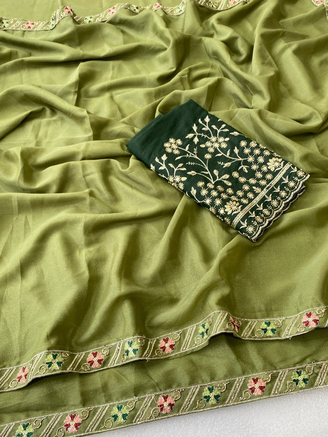 Timeless Green Solid Georgette Saree Finished With Graceful Floral Hand Embroidered Lace Border - Image 3