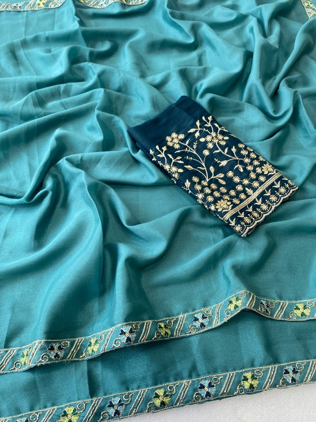 Timeless Blue Solid Georgette Saree Finished With Graceful Floral Hand Embroidered Lace Border - Image 4