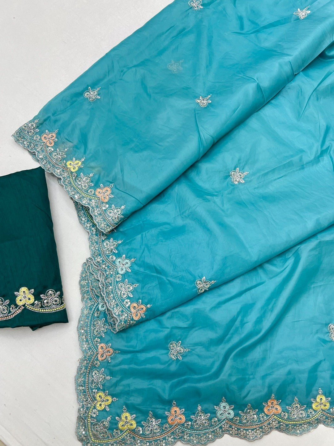 Elite Designer Blue Crystal Tissue Saree Showcasing Floral Embroidery & Sequins Detailing - Image 3
