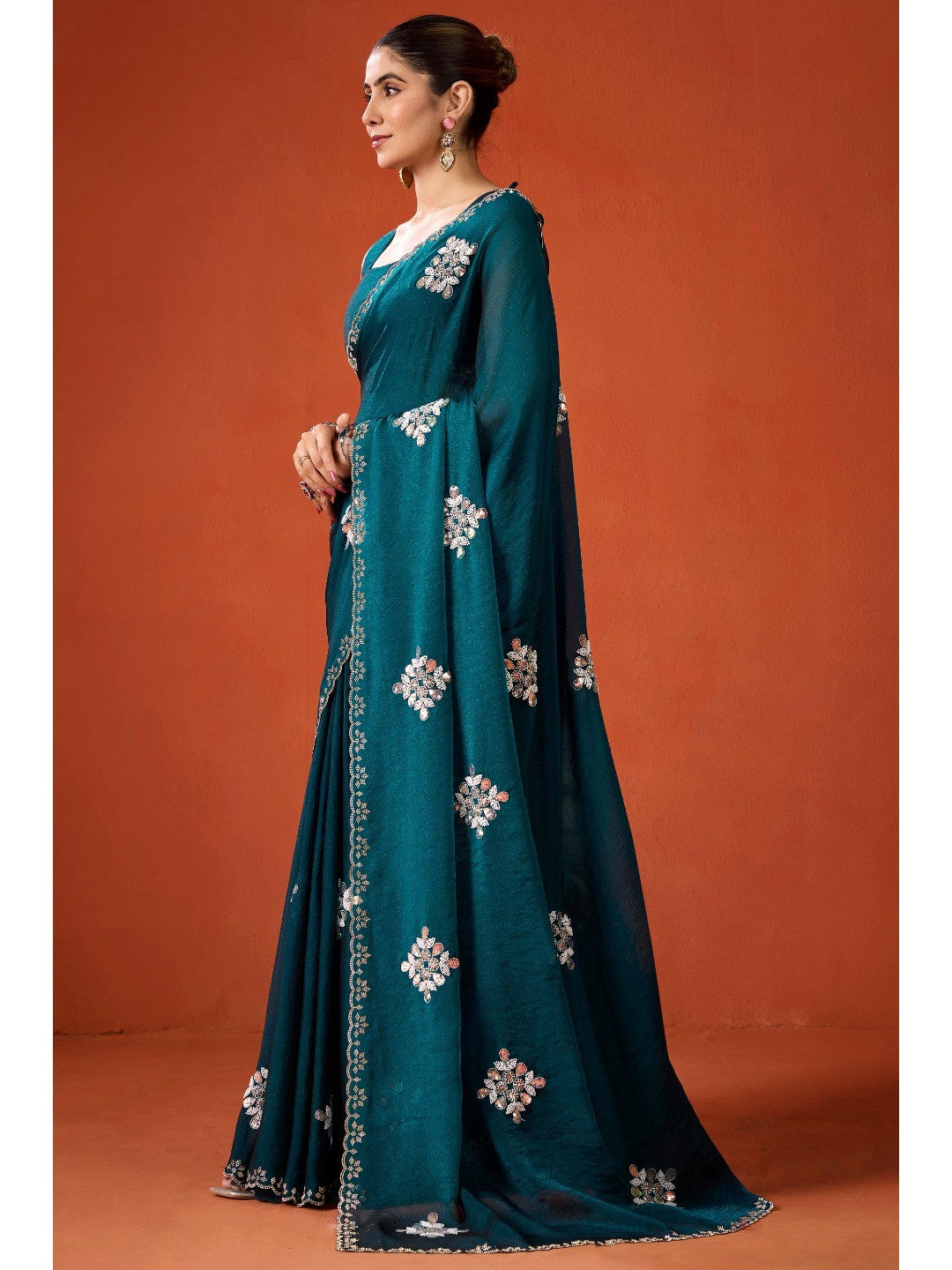 Graceful Teal Georgette Silk Saree Adorned with Floral Embellishments - Image 3