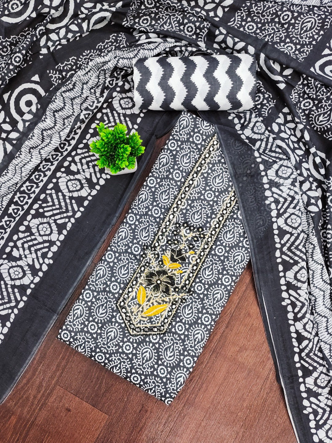 Classic Black Printed Cotton Blend Dress Material Highlighted With Delicate Floral Embroidery On Neck - Image 1