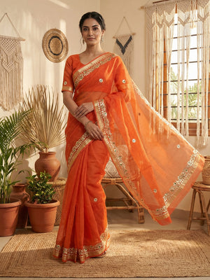 Graceful Orange Kota Doria Saree Adorned With Delicate Floral Gota Patti & Zari Weaving Border - Image 1
