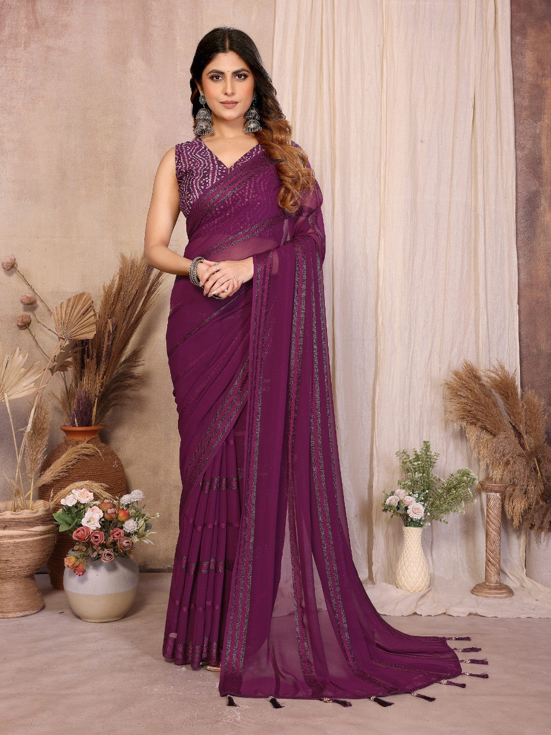 Elegant Wine Zari Striped Weaving Georgette Saree Highlighted With Tassel Pallu - Image 1