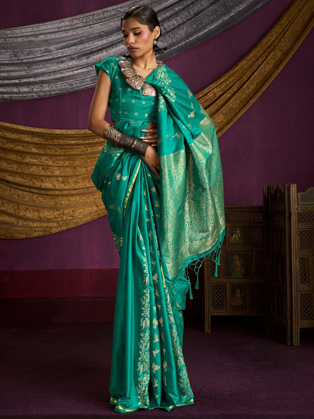 Majestic Rama Green Floral Weaving Work Satin Saree Featuring Designer Tassels Pallu - Image 1