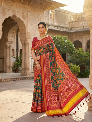 Exquisite Green Patola Print Handloom Silk Saree with Handcrafted Tassel Detailing - Image 1