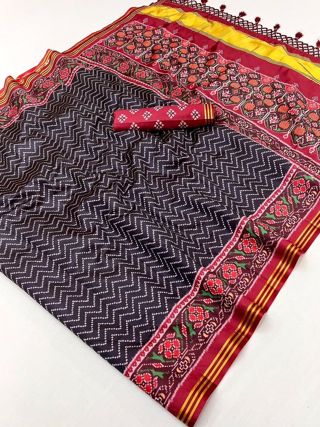 Traditional Black Patola Print Handloom Silk Saree with Pallu Tassel Detailing - Image 2