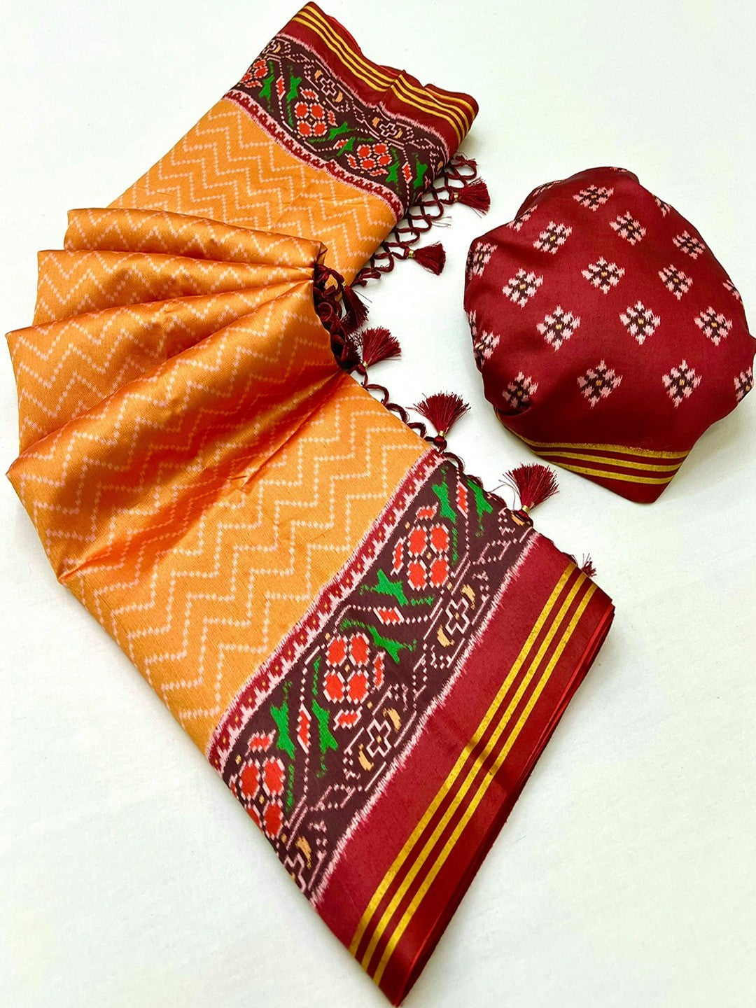 Traditional Orange Patola Print Handloom Silk Saree with Pallu Tassel Detailing - Image 3