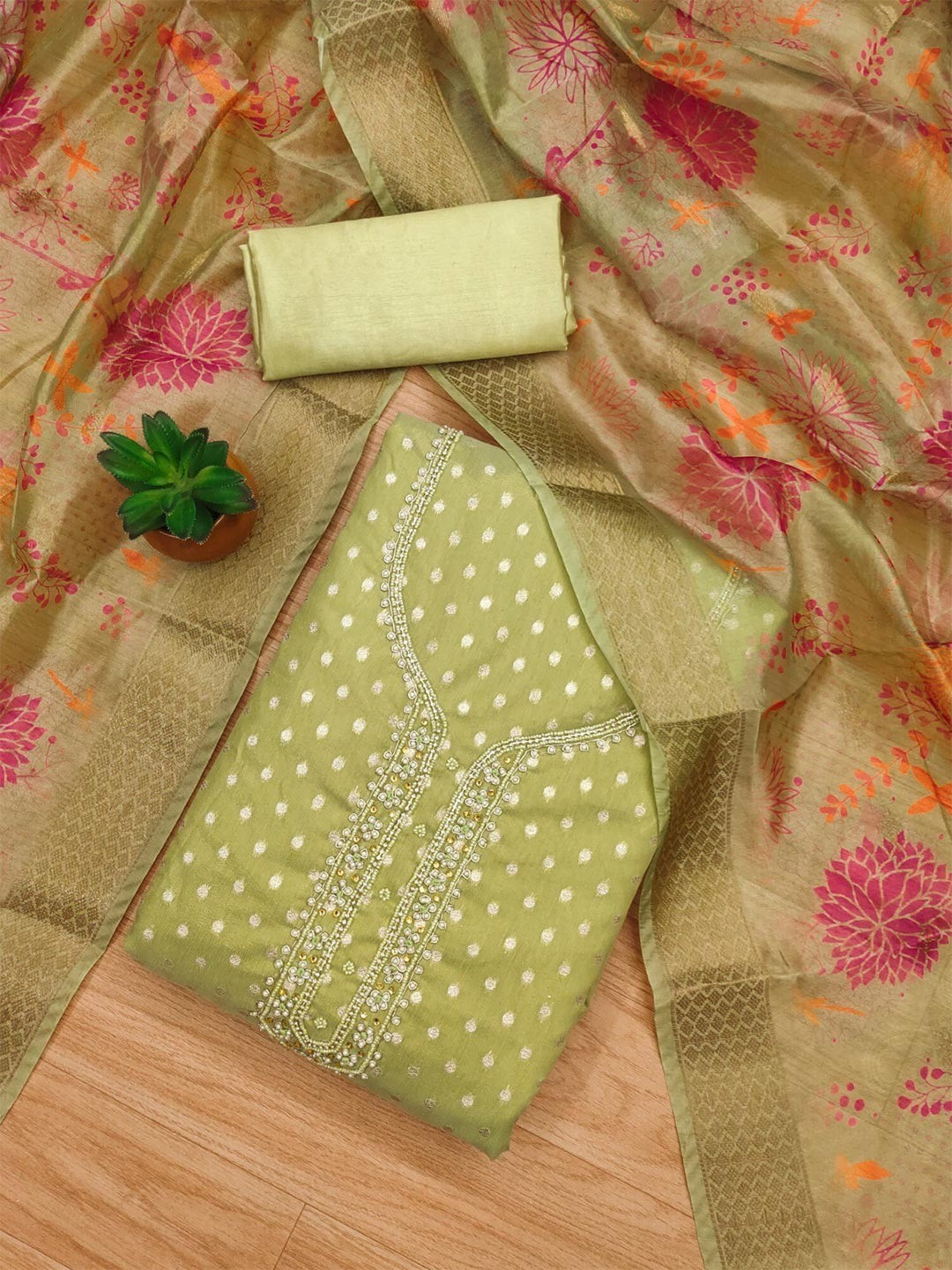 Premium Green Woven Shimmer Dress Material Enhanced With Delicate Moti Beads & Stone Handwork - Image 1