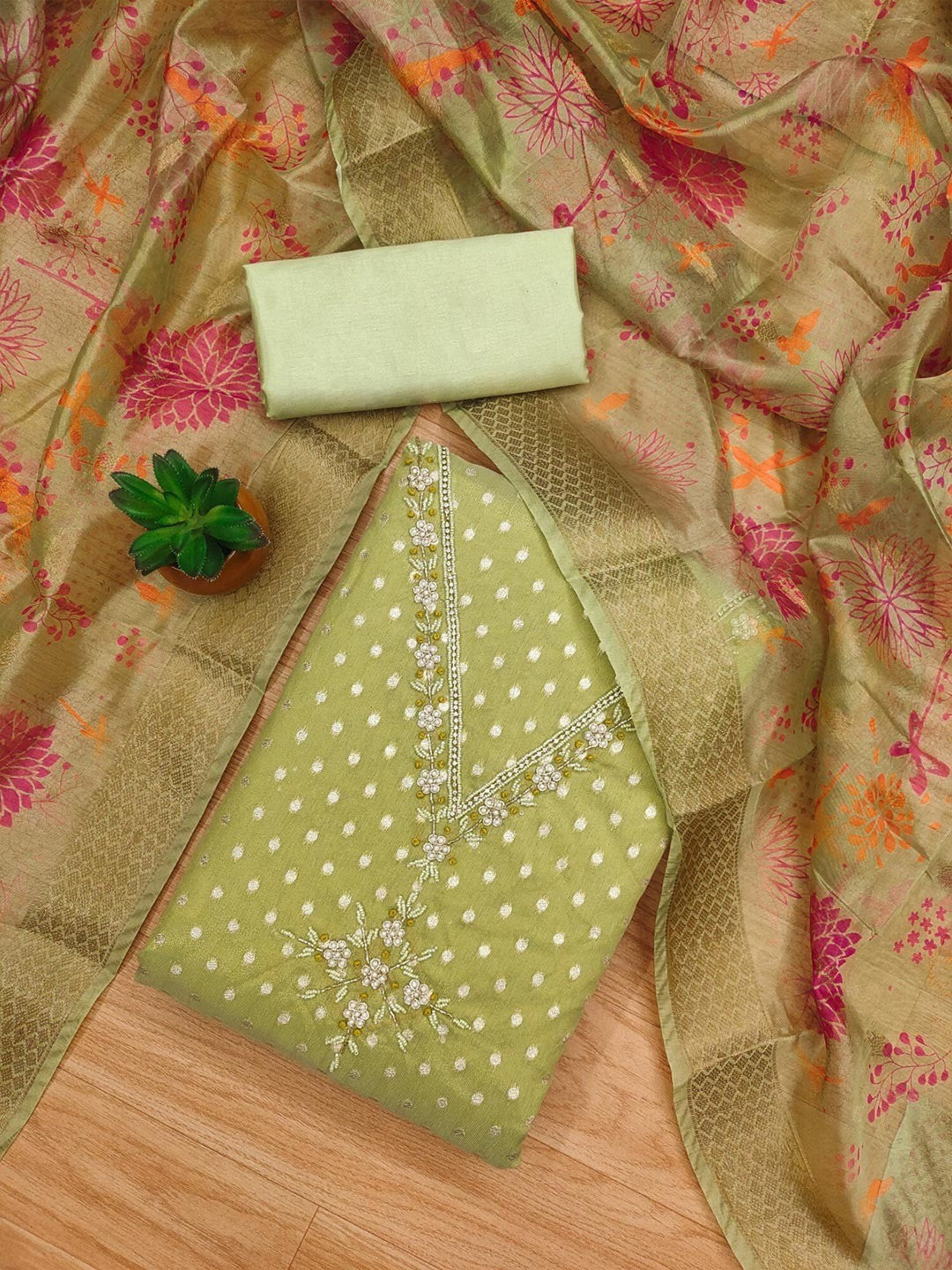 Luxury Green Woven Shimmer Dress Material Featuring Exquisite Moti Beads & Stone Embellishment - Image 1